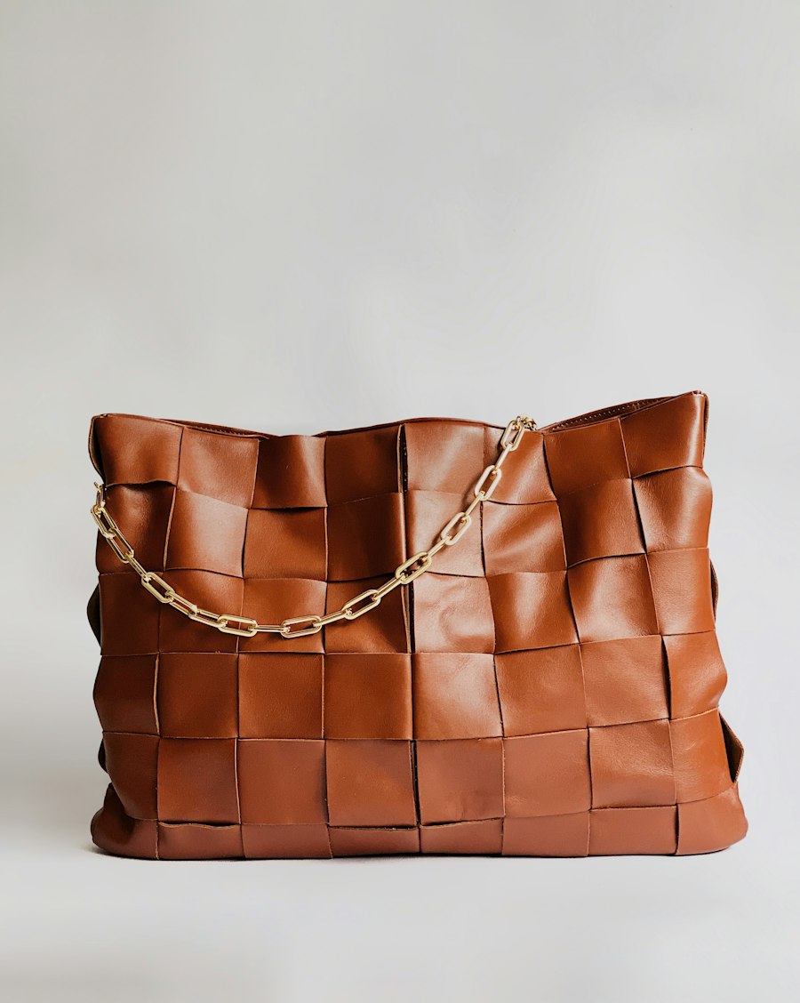 A brown woven leather handbag